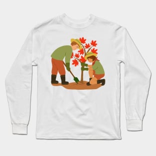 Young couple planting red maple tree. Outdoors gardening concept. Long Sleeve T-Shirt